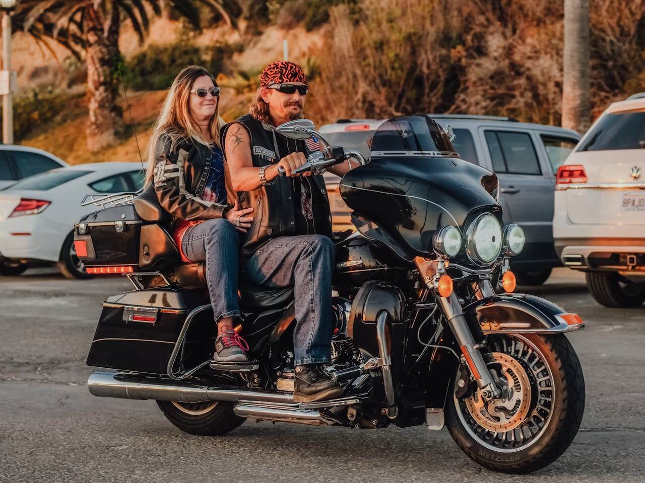 a couple riding a Harley-Davidson Touring model